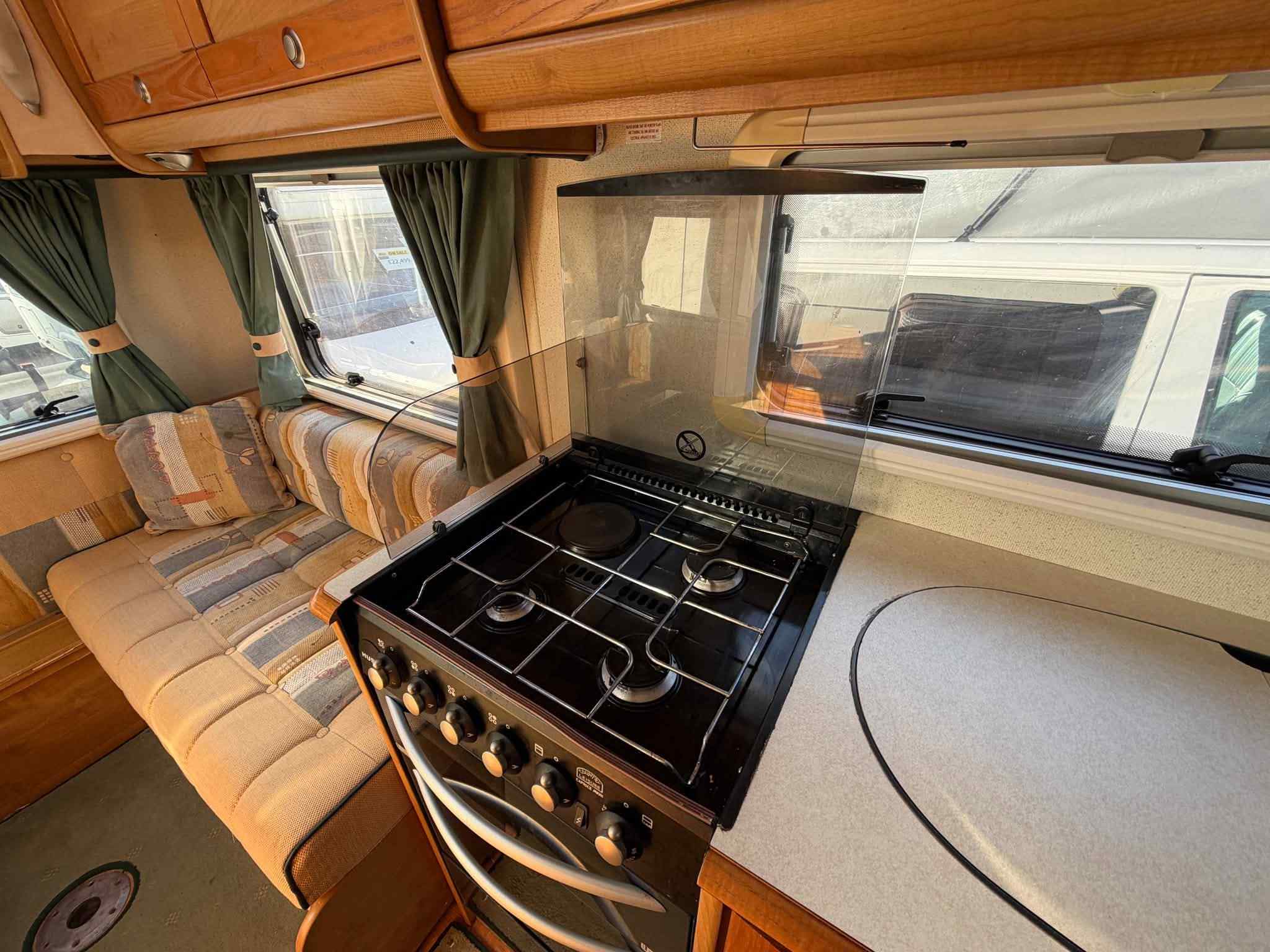 2005 Auto-Trail Tracker SE motorhome showing kitchen area with worktop and cooking facilities